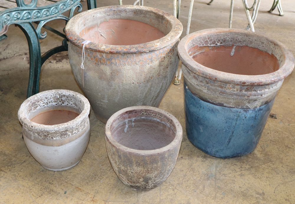 Four earthenware garden pots, largest 36cm diameter, H.33cm